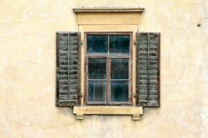 Aging wooden window showing signs it needs replacement
