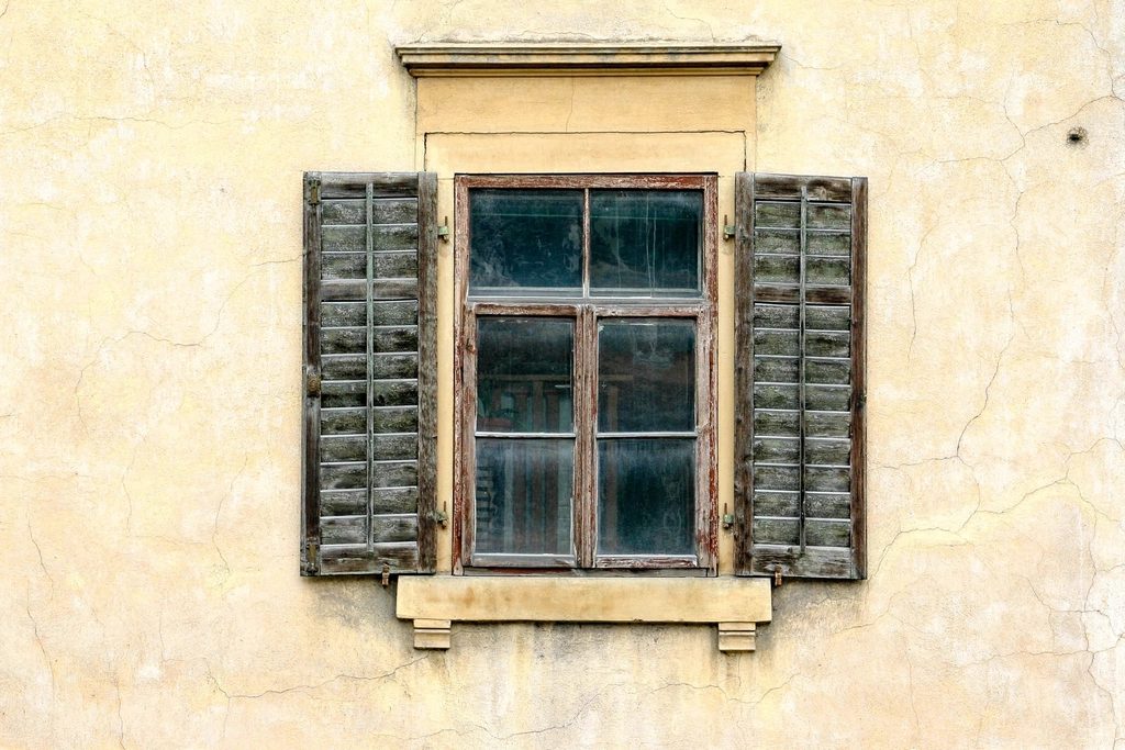 Aging wooden window showing signs it needs replacement